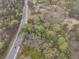 Overhead shot reveals a treed lot with a small building providing a serene, natural retreat at 5655 Campbellton Sw Rd, Atlanta, GA 30331