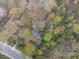 Aerial view of the property showcasing its mature trees and location near a street at 5655 Campbellton Sw Rd, Atlanta, GA 30331