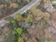A high angle view of the treed lot, showing surrounding trees and street at 5655 Campbellton Sw Rd, Atlanta, GA 30331