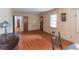 Inviting living room featuring hardwood floors, natural light, and traditional architectural details at 5655 Campbellton Sw Rd, Atlanta, GA 30331