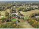 Expansive aerial of the lush golf course, community, and nearby water tower at 3047 Players Dr, Jonesboro, GA 30236