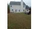 Exterior shot of the backyard and patio, complete with a playset and a grassy lawn at 102 Ozark Trl, Canton, GA 30114