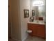Bathroom with double sinks, vanity, and decorative mirror at 102 Ozark Trl, Canton, GA 30114