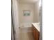 Bathroom features a jetted tub and oak vanity at 102 Ozark Trl, Canton, GA 30114