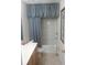 Full bathroom with toilet, vanity, tub and patterned shower curtain at 102 Ozark Trl, Canton, GA 30114