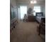 Bedroom with a bed, chair, dresser, and storage shelves at 102 Ozark Trl, Canton, GA 30114
