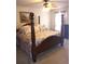 Spacious bedroom with a four poster bed and floral accents at 102 Ozark Trl, Canton, GA 30114