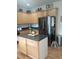 Kitchen with stainless steel appliances, center island, and wooden cabinets at 102 Ozark Trl, Canton, GA 30114