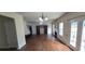 Bright living room featuring hardwood floors, a fireplace, and french doors to the backyard at 102 Ozark Trl, Canton, GA 30114