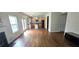 Open-concept layout with hardwood floors connecting the living room and kitchen with an island at 102 Ozark Trl, Canton, GA 30114