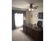 Well-lit home office with large desk and ceiling fan at 102 Ozark Trl, Canton, GA 30114