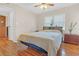 Bedroom with wood floors, ceiling fan, and window coverings at 276 Lakemoore Ne Dr # E, Atlanta, GA 30342