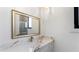 Modern bathroom features white marble counters, gold fixtures, and framed mirror at 3785 Lower Roswell Rd, Marietta, GA 30068