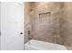 The bathroom features beautiful marble tile throughout, a built-in niche, and a sleek shower head at 3785 Lower Roswell Rd, Marietta, GA 30068