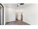 Neutral bedroom with dark plank floors, ceiling fan, and brick patio access at 3785 Lower Roswell Rd, Marietta, GA 30068