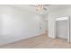 An open view into bedroom with hardwood floors, white walls, and a closet with open doors at 3785 Lower Roswell Rd, Marietta, GA 30068