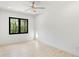 Bright bedroom features a ceiling fan with light and a large window that offers plenty of natural light at 3785 Lower Roswell Rd, Marietta, GA 30068