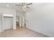 This bright bedroom features a ceiling fan with light and an ensuite bath and walk-in closet at 3785 Lower Roswell Rd, Marietta, GA 30068