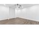 Bright bedroom boasts hardwood floors, a ceiling fan, and recessed lighting at 3785 Lower Roswell Rd, Marietta, GA 30068
