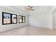 Bright bedroom with hardwood floors, large windows, and a tray ceiling with modern lighting at 3785 Lower Roswell Rd, Marietta, GA 30068
