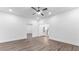 Spacious living room features hardwood floors, recessed lighting, and open access to stairs and other rooms at 3785 Lower Roswell Rd, Marietta, GA 30068