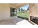 Covered patio has travertine floors, stone fireplace and an open view to the backyard at 3785 Lower Roswell Rd, Marietta, GA 30068