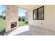 Covered patio featuring a stone fireplace and tile flooring for outdoor relaxation and entertaining at 3785 Lower Roswell Rd, Marietta, GA 30068