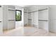 Spacious walk-in closet with custom shelving and a window offering natural light at 3785 Lower Roswell Rd, Marietta, GA 30068