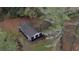 Aerial view of a house nestled among tall trees at 773 Harwell Nw Rd, Atlanta, GA 30318