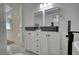 Updated bathroom featuring double vanity and a freestanding tub at 773 Harwell Nw Rd, Atlanta, GA 30318