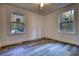 Well-lit bedroom with two windows and wood-look floors at 773 Harwell Nw Rd, Atlanta, GA 30318