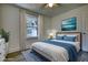 Bedroom with a queen bed and blue bedding, hardwood floors and large window at 773 Harwell Nw Rd, Atlanta, GA 30318