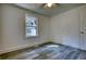 Simple bedroom with wood-look floors and a window at 773 Harwell Nw Rd, Atlanta, GA 30318
