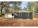 Dark brick home with white accents and a spacious backyard at 773 Harwell Nw Rd, Atlanta, GA 30318