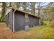 Dark brick home with large windows and a grassy yard at 773 Harwell Nw Rd, Atlanta, GA 30318