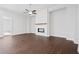 Spacious living area featuring a modern fireplace with a sleek design and hardwood floors at 738 Stickley Oak Way, Woodstock, GA 30189