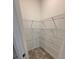 Walk-in pantry with shelving and ample storage space for food and kitchen essentials at 1267 Lucan Nw Ln # Wc217, Lawrenceville, GA 30043