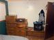 Bedroom features wood dresser, record player, and closet space at 745 Shiloh Nw Rd, Kennesaw, GA 30144