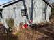 View of the exterior of the detached garage with two windows and three chairs at 745 Shiloh Nw Rd, Kennesaw, GA 30144