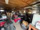 View of the interior of the detached garage filled with various items at 745 Shiloh Nw Rd, Kennesaw, GA 30144