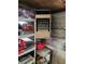 View of the interior of the detached garage with heater on the wall, brick wall, and shelving at 745 Shiloh Nw Rd, Kennesaw, GA 30144