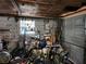 View of the interior of the detached garage filled with various items, including engine at 745 Shiloh Nw Rd, Kennesaw, GA 30144