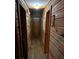Hallway features rustic wood paneling, hardwood floors and recessed lighting at 745 Shiloh Nw Rd, Kennesaw, GA 30144
