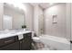 Modern bathroom with marble vanity and subway tile shower at 1731 N Springs Dr, Dunwoody, GA 30338