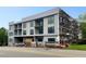 Modern new construction features private balconies and large picture windows, offering a sleek urban design at 318 Sandy Springs Cir # 150, Atlanta, GA 30308