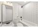 Modern bathroom with white subway tiles, bathtub, and updated vanity at 641 Hamilton E Holmes Nw Dr, Atlanta, GA 30318