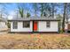 Charming renovated home with a bright orange door at 641 Hamilton E Holmes Nw Dr, Atlanta, GA 30318