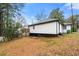 Side view of the house showcasing clean white siding at 641 Hamilton E Holmes Nw Dr, Atlanta, GA 30318