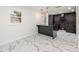 Modern kitchen with dark cabinetry, marble floors, and an island at 641 Hamilton E Holmes Nw Dr, Atlanta, GA 30318
