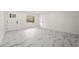 Open living area with marble-look floors and an abundance of natural light at 641 Hamilton E Holmes Nw Dr, Atlanta, GA 30318